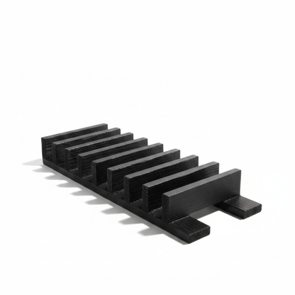 ARTSN black charred wooden rack with slots for knives on a white background